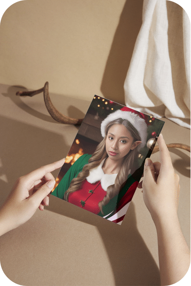 Hands holding a holiday-themed photo print featuring a young woman in a Santa outfit, against a festive background with Christmas decorations, symbolizing a family-friendly photo booth experience at a corporate holiday party.
